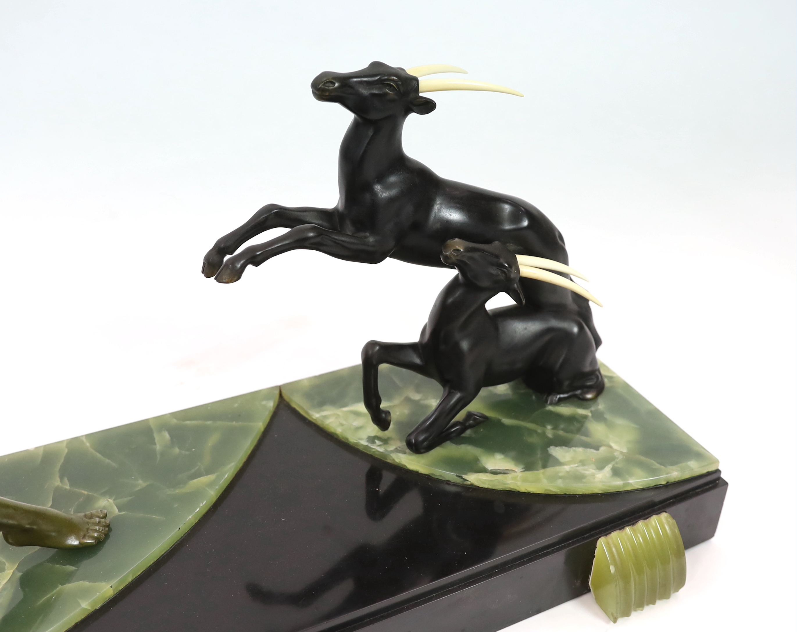 Attributed to Ugo Cipriani (Italian, 1887-1960). An Art Deco bronzed spelter group of an archer shooting at two antelopes, 82cm wide, 24cm deep, 55cm high